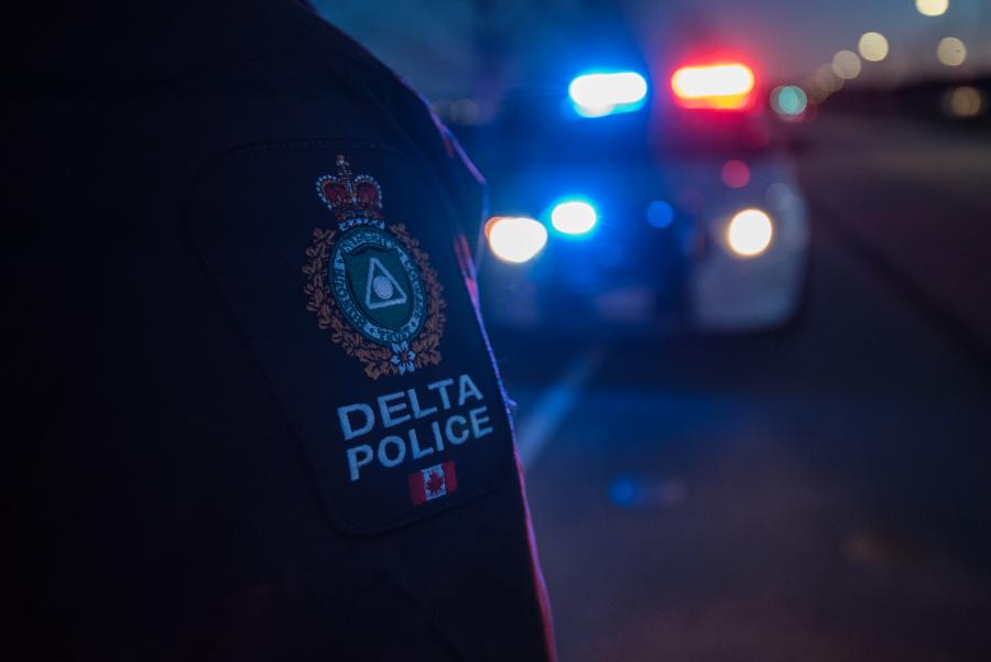 Uniform shoulder flash and police car in distance